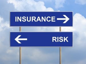 Sign pointing to insurance and risk